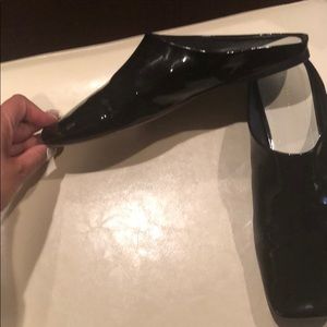 Classic Celine black patent slides.